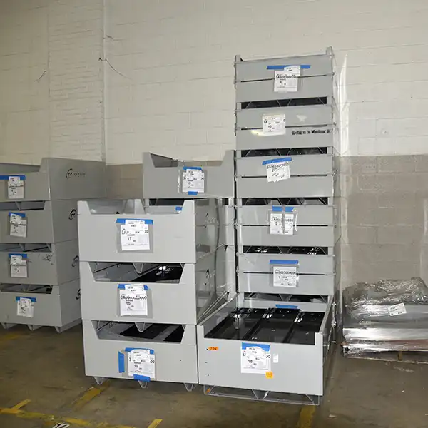 Returnable stacked bins for efficient industrial storage and transportation.